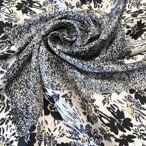 Floral print silk square scarf with hand-painted black flowers and golden accents