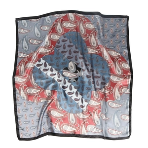Detail of vintage paisley pattern on large 90cm satin silk square scarf with blue and red hues
