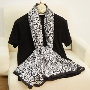 Elegant silk-like long scarf featuring classic black and white rose floral print patterns