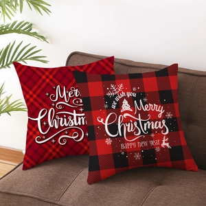 Set of two Christmas buffalo check pillow covers with festive deer and holiday greetings