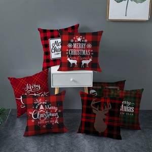 Set of Christmas pillow covers with red and black plaid reindeer and snowflake patterns