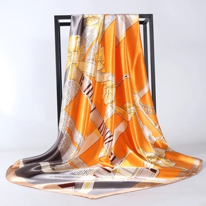 Elegant 90cm satin square scarf with chain and buckle print on orange backdrop