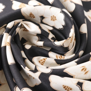 Floral twill satin square scarf with large white flower prints on black background