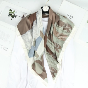 Artistic ink silk scarf with geometric abstract print on camellia hanger backdrop