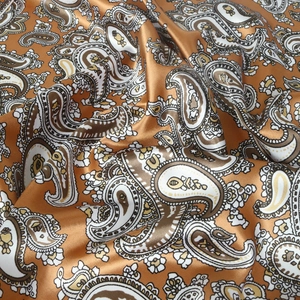 Orange gold paisley satin scarf with vintage floral patterns and silky glossy texture