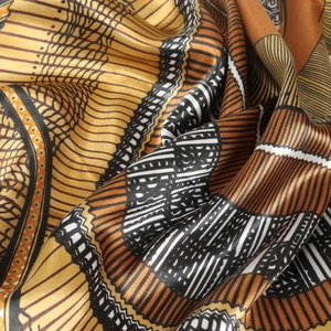 90cm vintage satin square scarf featuring geometric patterns in gold and orange tones
