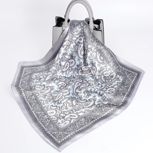 60cm vintage paisley satin square scarf in grey and blue draped on a handbag