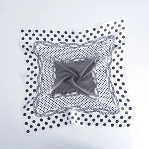 Detailed view of 60cm satin square scarf with polka dots and golden chain patterns