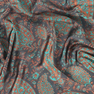 Vintage paisley print square silk scarf with teal and orange patterns on charcoal fabric