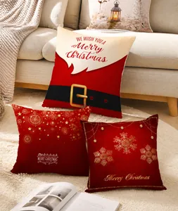 Detail of Christmas peach skin pillow covers featuring Santa and gold snowflake designs