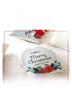 Detail of linen Christmas pillowcases with festive snowman prints and Merry Christmas text