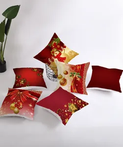 Detail of six Christmas pillow covers featuring festive red and gold holiday patterns