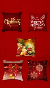 Detailed view of red Christmas pillow covers with gold snowflakes and festive motifs