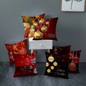 Housse de coussin rouge Noël avec motifs de cadeaux dorés et texte de vœux
