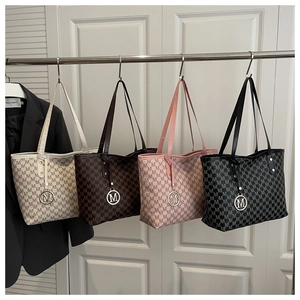 Detail view of large capacity tote bags in four colors with classic M-pattern prints