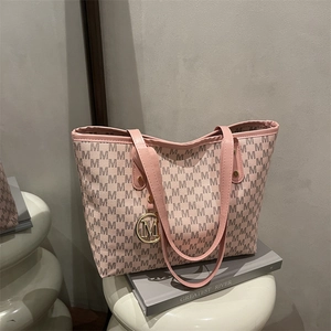 Pink large-capacity tote bag with repeat M pattern and golden metal M charm for daily commute