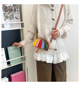 Detailed close-up of a creative umbrella-shaped bag with colorful five-color stitching