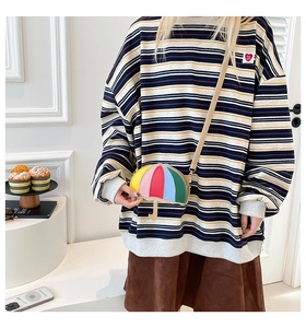 Close-up of a colorful umbrella-shaped crossbody bag with vibrant multi-color patchwork