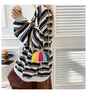 Detailed view of creative rainbow umbrella-shaped crossbody bag with colorful PU leather