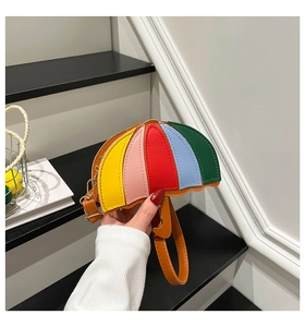 Detailed view of mini umbrella-shaped crossbody bag with vibrant colorful block panels