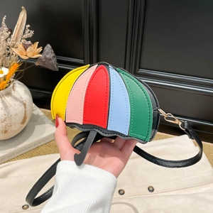 Mini umbrella-shaped crossbody bag with vibrant multi-color patchwork and black strap