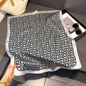 70cm square silk scarf featuring modern black geometric patterns on white fabric