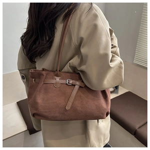 Brown frosted suede tote bag shown on model for a vintage minimalist autumn look
