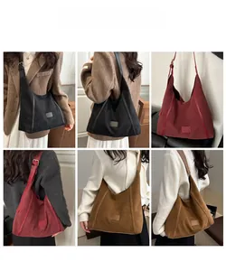 Three-color oversized matte suede Hobo shoulder bags shown on models in varied autumn outfits
