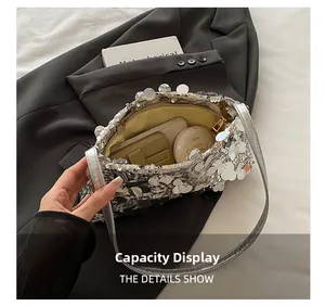 Internal view of silver sequin bag showing capacity for phone and cosmetics