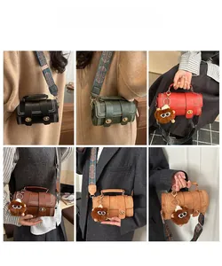 Detail showing vintage Boston barrel bags with patterned straps and plush charms