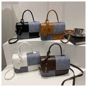 Group display of chic square crossbody bags in four colors on a tiered minimalist stand