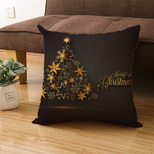 Black Christmas pillow case with golden star tree and Merry Christmas text on wood floor