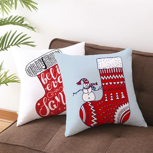 Christmas snowman and stocking throw pillow covers set on a cozy sofa for home decor