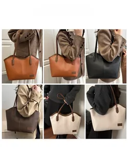 Collage showing four colors of a large vintage tote bag worn by models in a studio