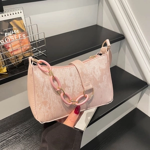 Chic pink glossy chain shoulder bag for women with metallic texture and trendy design