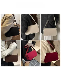 Detailed view of six matte underarm bags in various colors showing shoulder fit and wave base