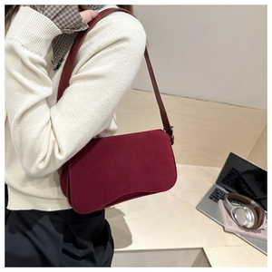 Close-up of the burgundy matte shoulder bag with a sleek rectangular rounded corner design