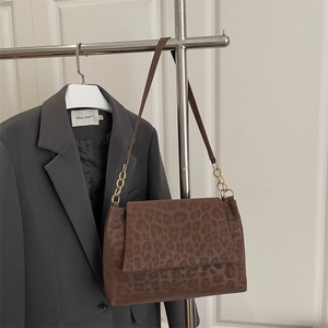 Brown leopard print shoulder bag with gold chain strap and matte finish texture