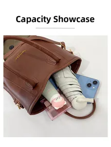 Interior view showing the large capacity of the brown pebbled leather bucket bag