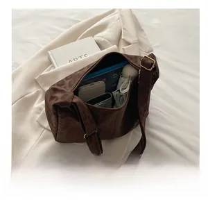 Detail showing high-capacity interior of brown leopard print tote bag with daily items