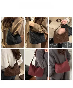 Detail view of large leopard print crescent tote bags in black, dark brown, and burgundy