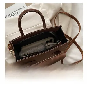 Internal view of the brown leopard bucket bag showing capacity for phone and wallet