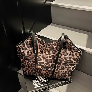 Large vintage leopard print tote bag with black handles and metal twist lock for women