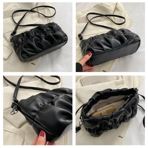 Detail views of black pleated cloud bag showing PU texture and internal storage capacity
