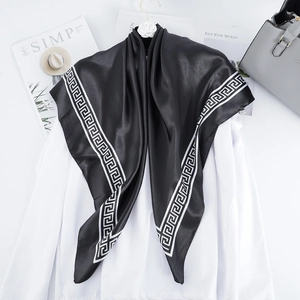 Classic black satin square scarf with white Greek key pattern on smooth silk-like fabric