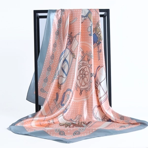 Coral and blue satin square scarf with vintage horse carriage print on display frame