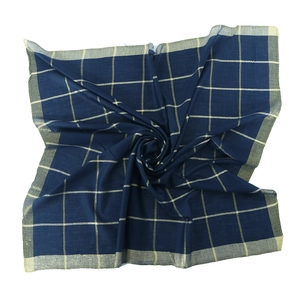 Macro detail of navy cotton square scarf featuring gold thread plaid and metallic borders