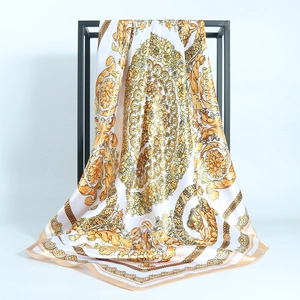 90cm satin square scarf with golden baroque paisley pattern draped on a minimal stand