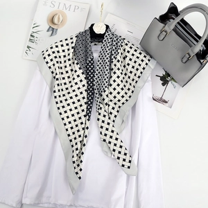 Classic black and white checkered silk scarf for women styled with casual white shirt