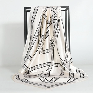 Elegant 90cm silk-feel square scarf with black and white geometric chain print on metal rack